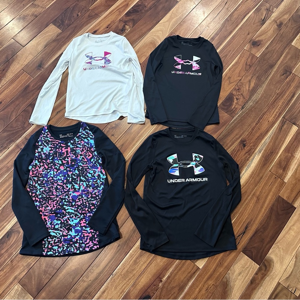 Lot of 4 Under Armour t-shirts size small and medium lightly used slick feel